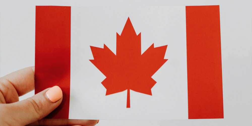 Woman holding Canadian flag