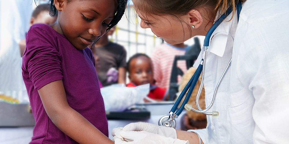 SGU Graduate attending to Child
