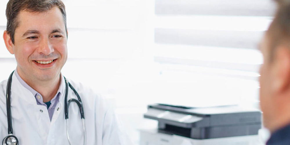 Doctor speaking with patient