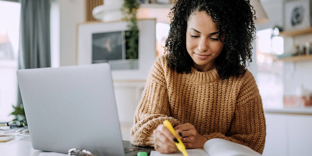 pre med student reviewing mcat prep materials|A pre-med student does research for the MCAT exam|A pre-med student does an MCAT practice exam|A pre-med student studies materials for the MCAT