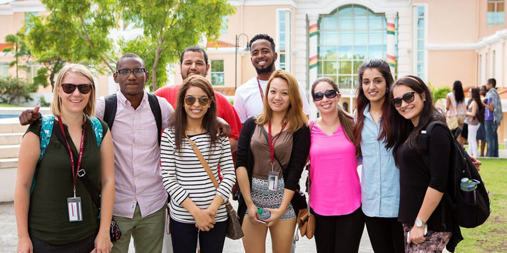 Group of SGU students smiling on campus