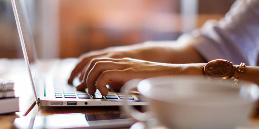 Student working on laptop in study space