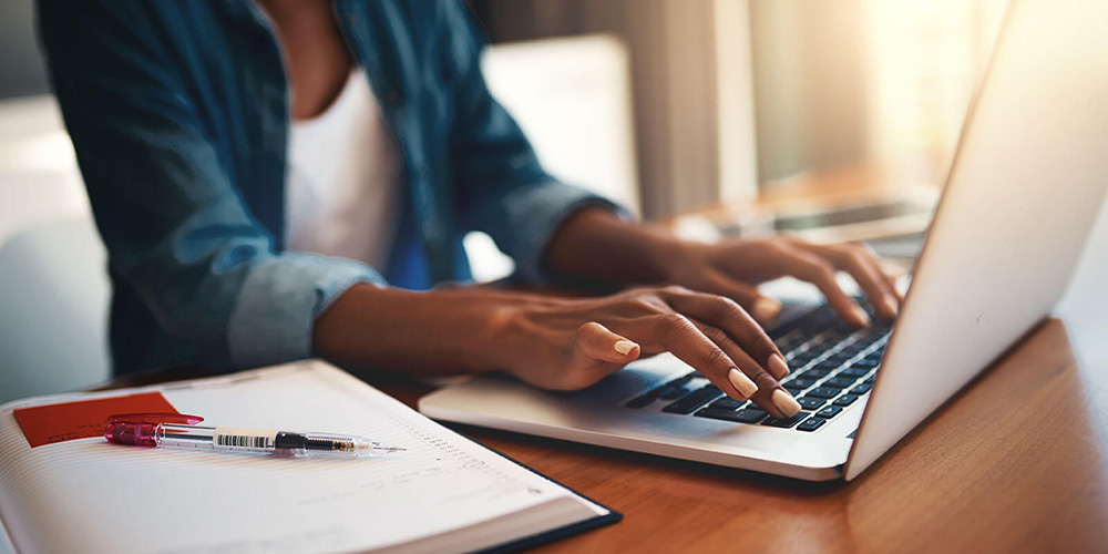 Applicant at computer working on medical school secondary application