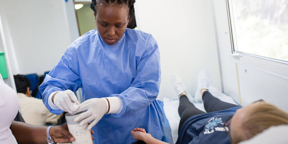 Student prepping child for bloodwork