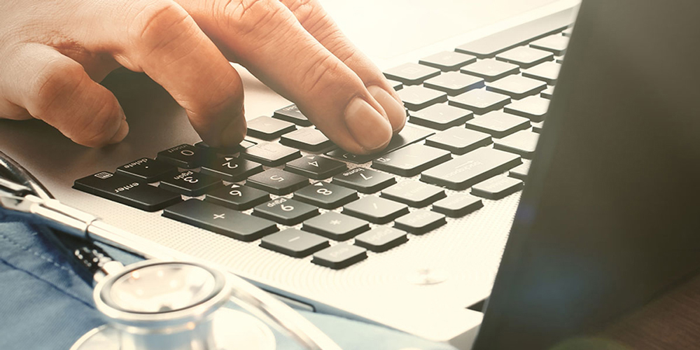 Healthcare Professional on a laptop