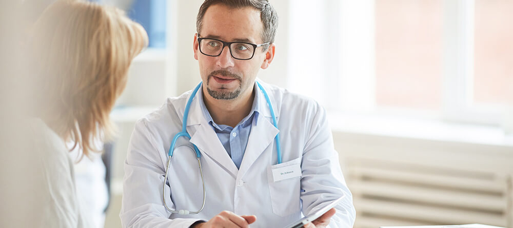 Male provider speaking with patient