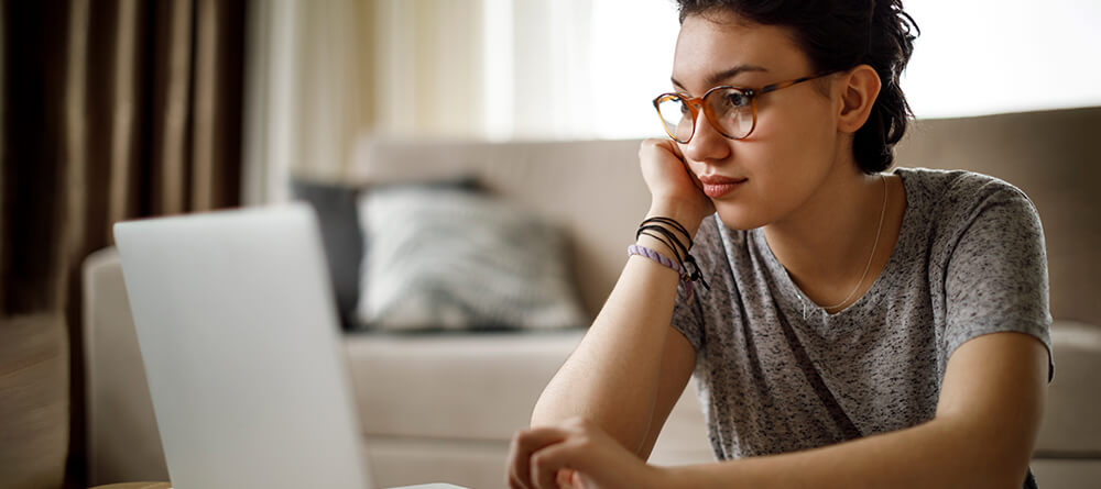 Close up of pre-med student on laptop preparing applications
