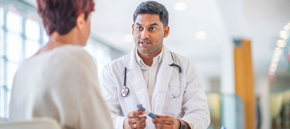 Primary care physician speaking with patient.