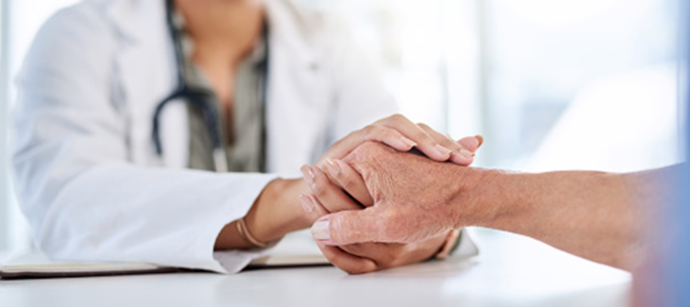 Doctor shaking hands with patient