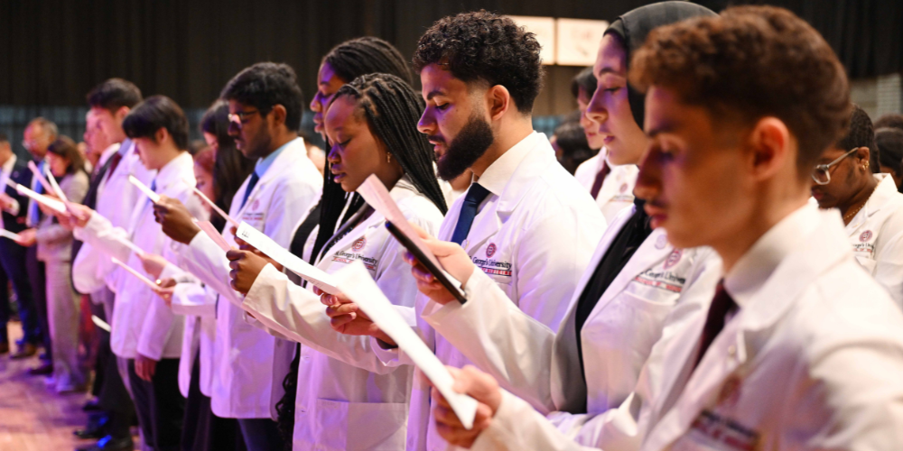 SOM students reciting the oath at the Fall 2025 Northumbria University White Coat Ceremony