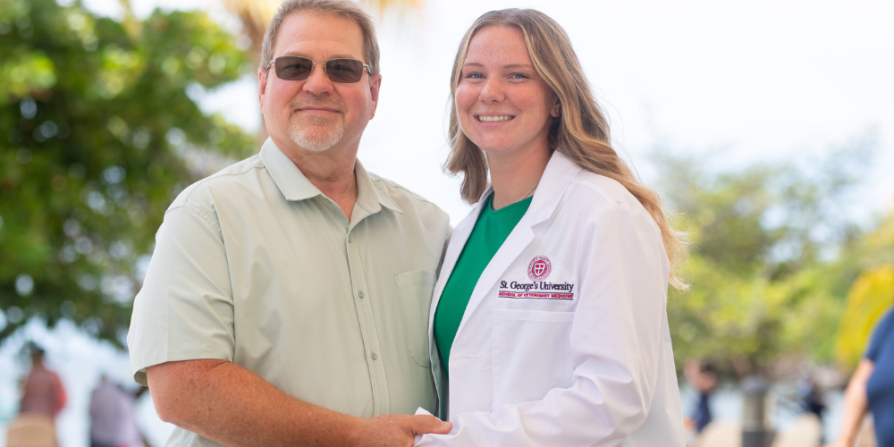 Scott Keaffaber, DVM ’04 and his daughter Term 1 SVM student Morgan Keaffaber at the Fall 2025 SVM White Coat Ceremony