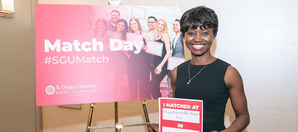 An SGU student smiles as they discover their IMG residency match