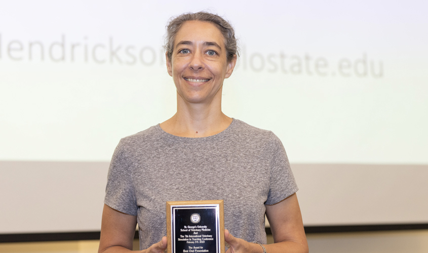 Dr. Francesca Ivaldi accepts her award for Best Oral Presentation.