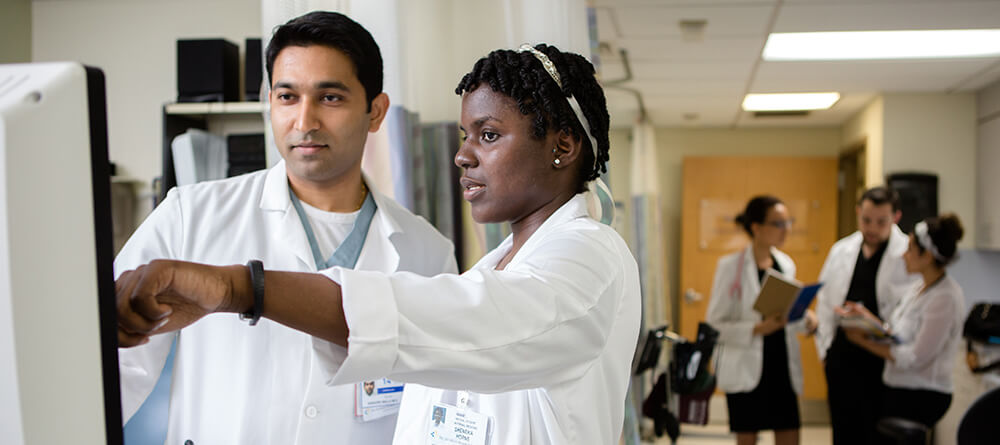 Doctors using computer