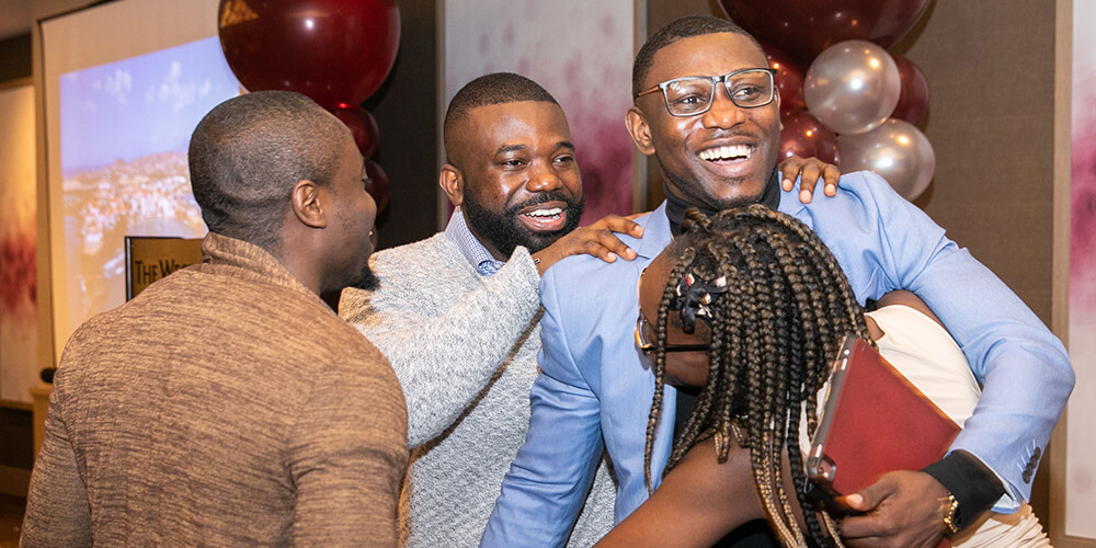 Student celebrating match with family