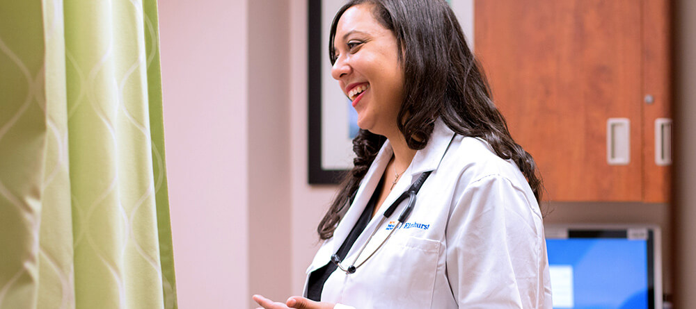 Doctor laughing with patient