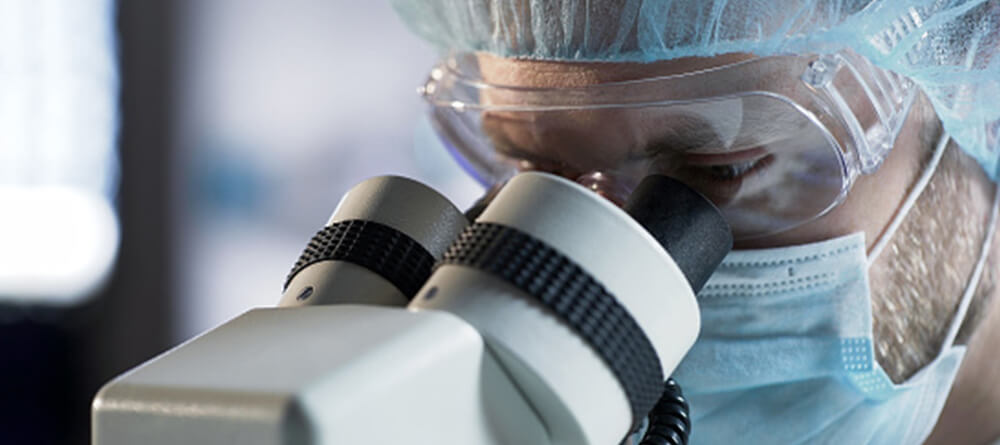 Student using microscope