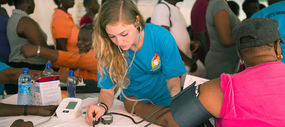Student taking blood pressure