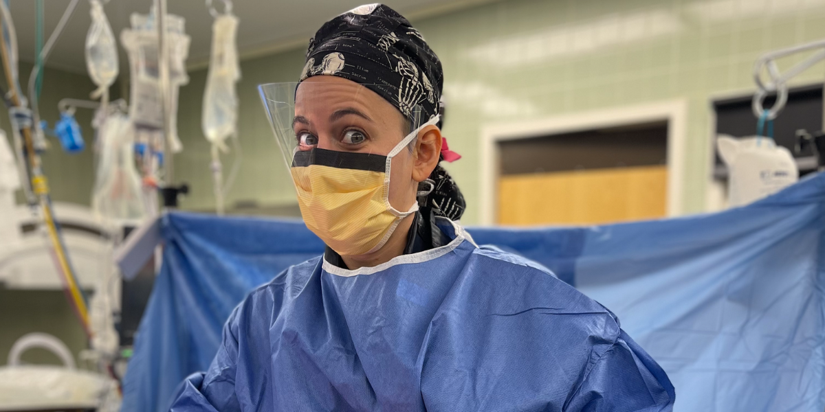 Dr. Deliso in blue scrubs in the operating room