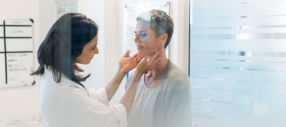 Female doctor performing a checkup on a patient
