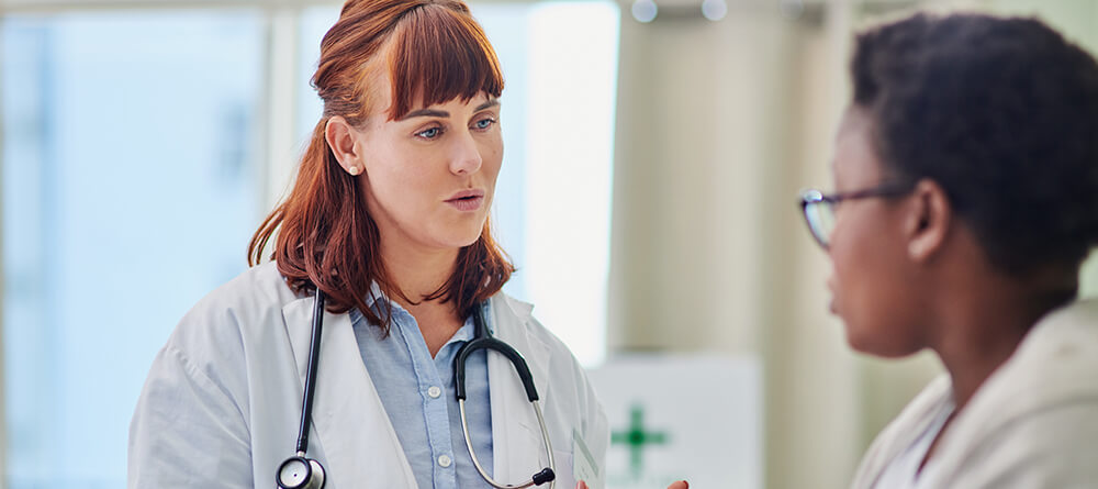 Doctor educating patient during an office visit