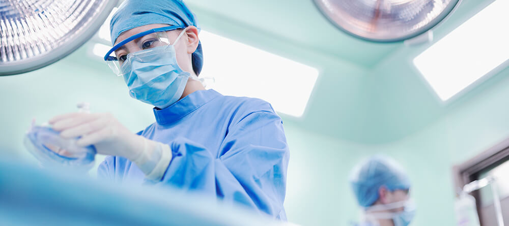 Anesthesiologist prepping a patient for surgery.