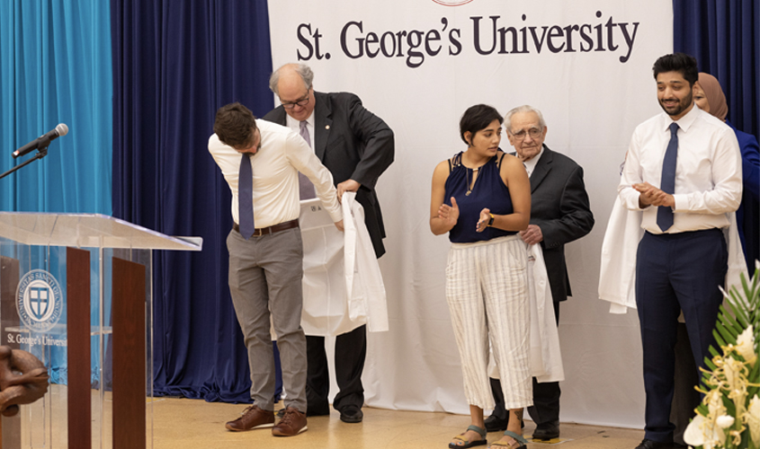 Dr. Olds also had the pleasure of coating his son, Trevor Olds in this heartfelt moment—an experience the Olds family will treasure.