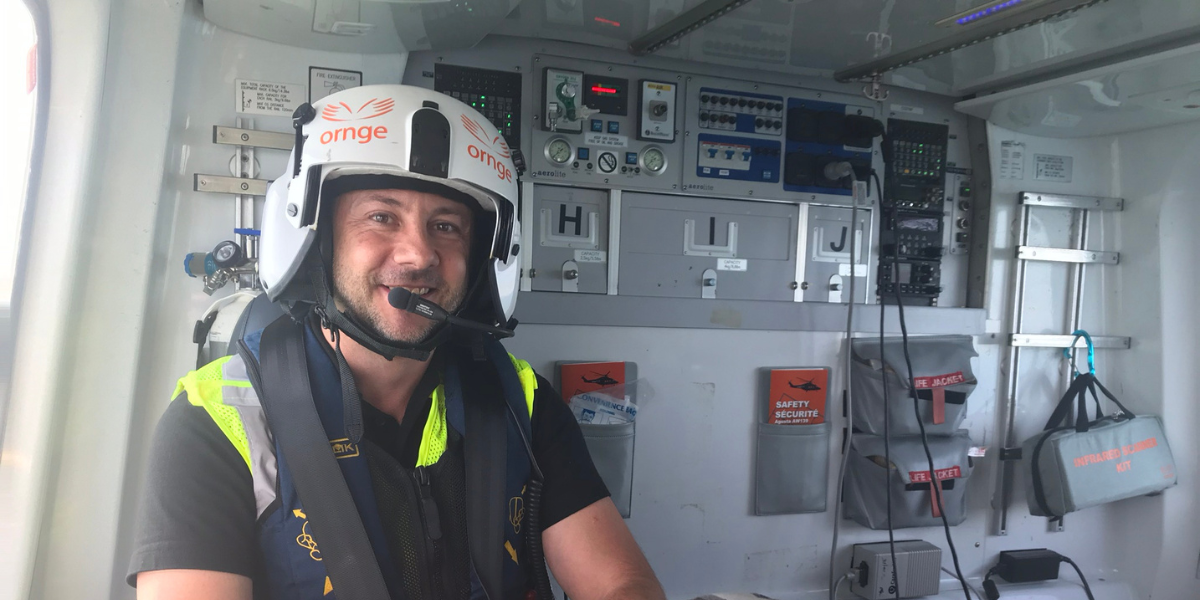 Dr. Beaumont sitting in a rescue aircraft