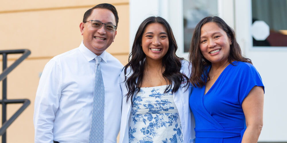 Alain Flores, MD ’98, and Theresa Ordona, MD ’98, with daughter, Marisa Ordona Flores