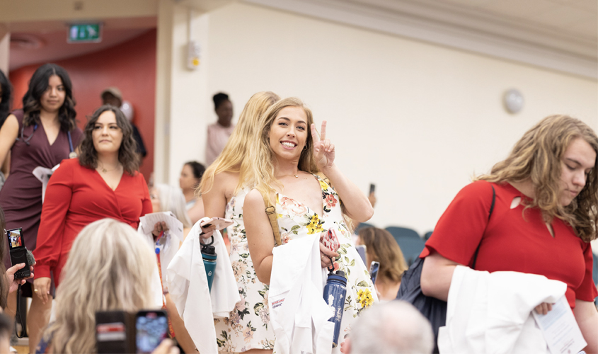 Nervousness and excitement abound as students made their way into the hall to await their turn to walk across the stage to receive their white coat.