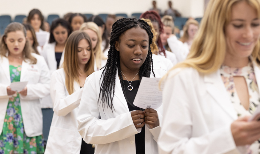 After donning their white coats, the ceremony came to a close with the students and other veterinarians in the hall reciting an oath of commitment to uphold the highest ethical standards and professionalism.