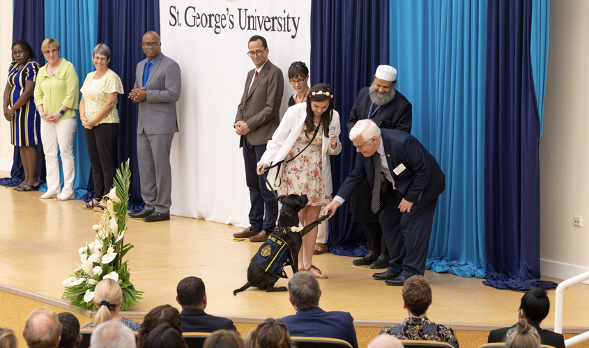 Sharing the stage with Jessica Meyer, SVM Term 1 student, was her epilepsy alert dog, Magnolia. The pair shared a touching moment as SVM Dean Dr. Neil Olson, stopped to shake Magnolia’s paw before leaving the stage.