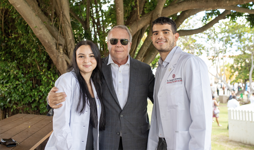 Holding back tears was Dr. Patrick Borgen, as he coated his daughter Dana Borgen and her fiancé Ezekiel Sanchez. The high school sweethearts chose to attend SGU together after meeting several SGU alumni residents at Maimonides Medical Center where Dr. Borgen serves as chair of the Department of Surgery. 
