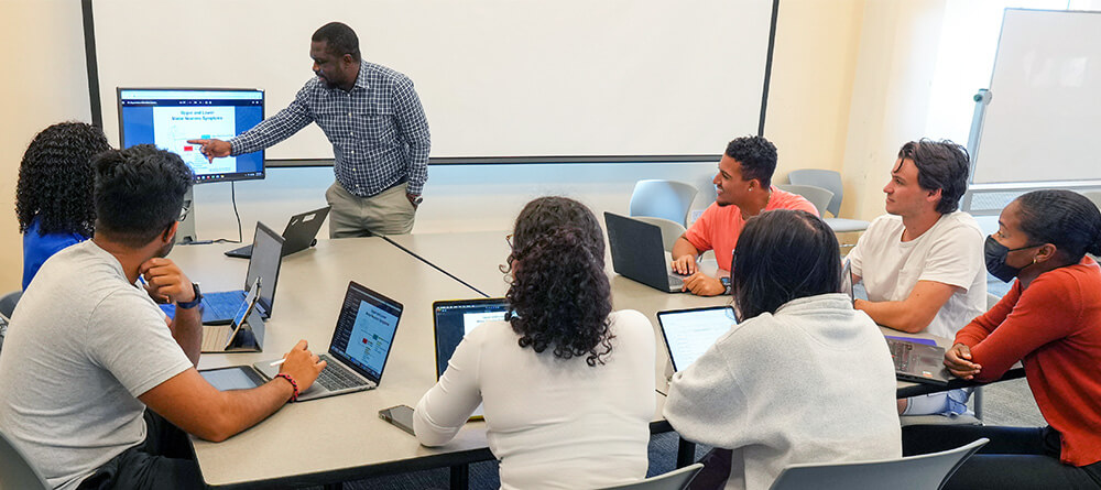 SGU students listening to professor in classroom