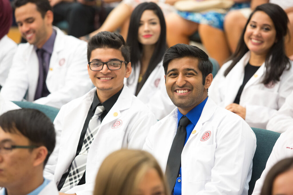 Newly admitted medical students receive their white coats at the SGU School of Medicine White Coat Ceremony.