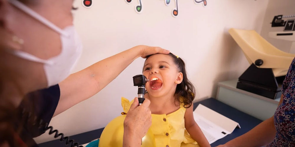 Doctor examining child