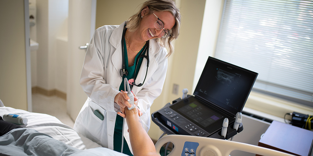 SGU Graduate with patient