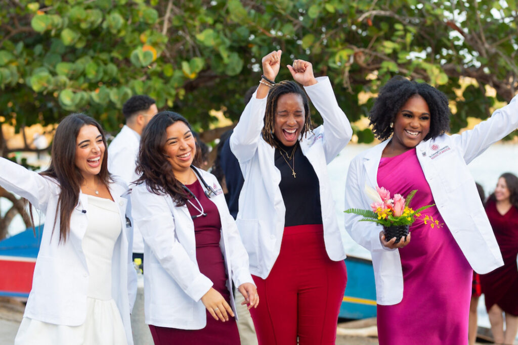 Students celebrating at white coat ceremony