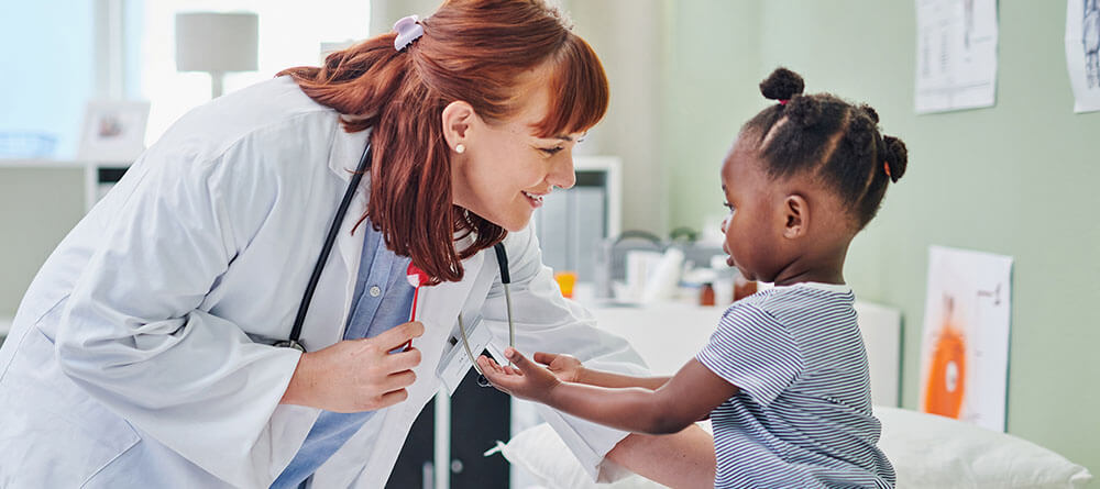 A doctor examines an infant child during a checkup