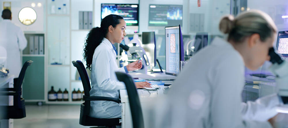 A forensic pathologist examines samples in a pathology lab